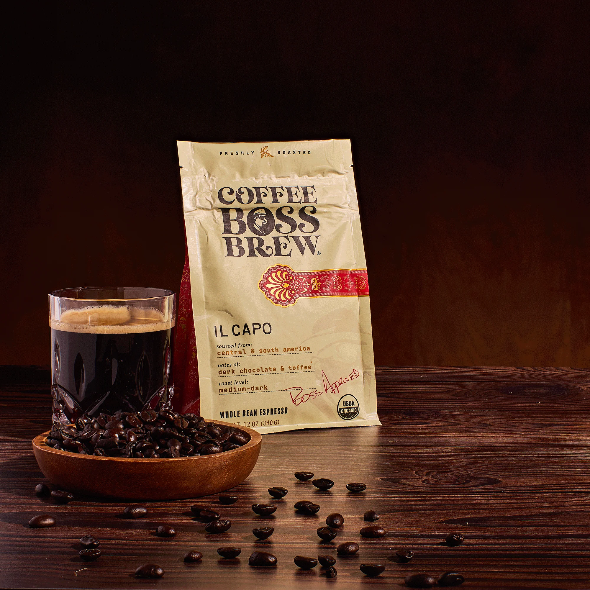 Coffee Boss Brew Il Capo bag alongside whole beans and a freshly brewed cup of espresso